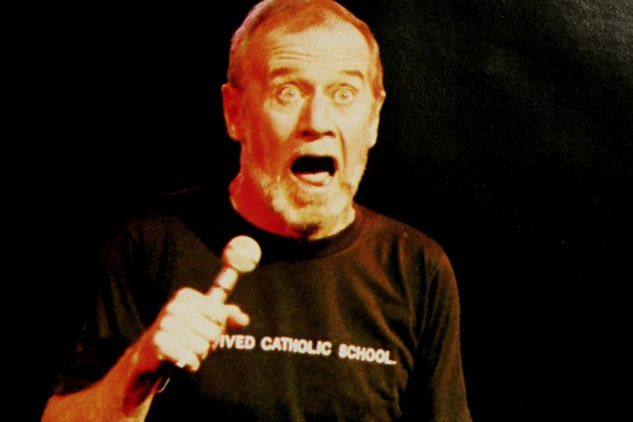George Carlin on stage at the Coliseum