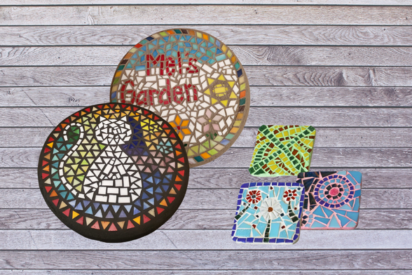 Mosaic sign depicting a cat. Mosaic sign reading "Mel's Garden." Mosaic coasters ... one with flowers and and two with random shapes.