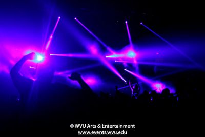 Concert photo showing the pink and purple lighting