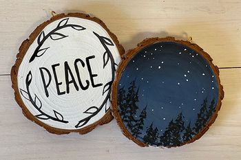 ornaments made from wood slices and painted with festive scenes