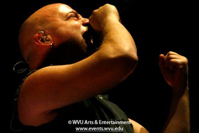 a member of the band Disturbed performing at the Coliseum in 2011