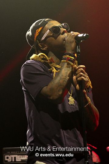 Lil Wayne in profile singing at the Coliseum
