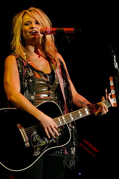 Miranda Lambert plays guitar on the Coliseum stage in 2011