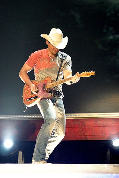 Brad Paisley playing guitar on the Coliseum stage in 2006.
