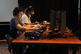 Students playing PC games at the individual stations in the Shenandoah Room.