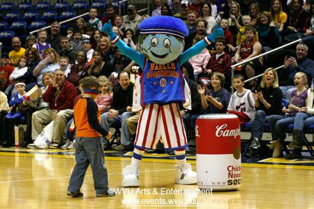 Globetrotter mascot Globie interacts with a child from the crowd.
