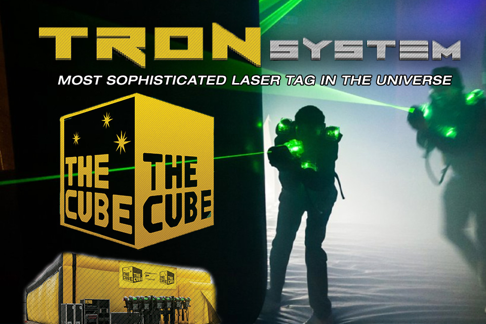 Tron system. Most sophisticated laser tag in the universe. Photo of two people wearing illuminated vests.