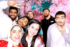 Students posing for a photo in front of the photo booth during Valentine's Weekend at WVUp All Night
