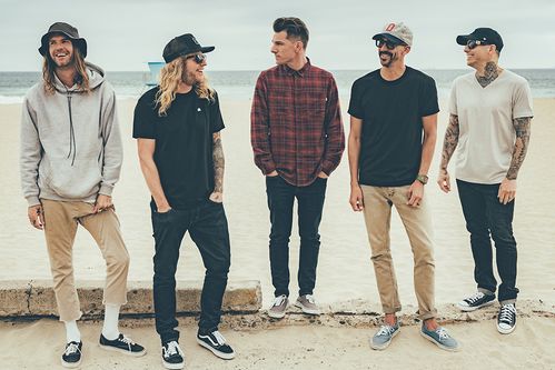 Members of the band Dirty Heads standing on a beach