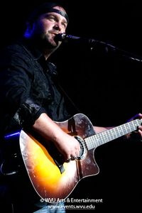 Lee Brice playing guitar in 2010.