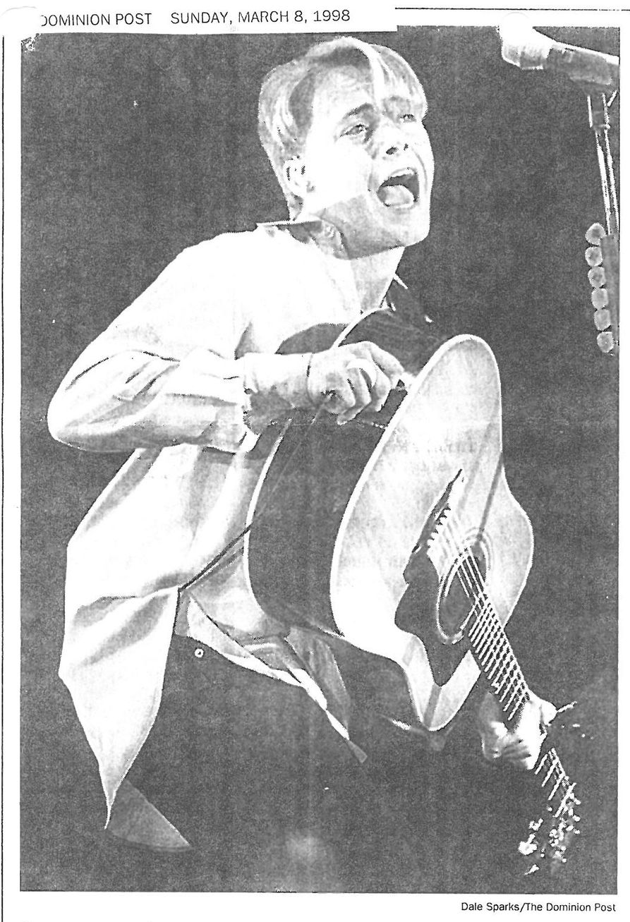 Photo of Bryan White on stage at the Coliseum in 1998. Photo appeared in the Dominion Post. Photographer: Dale Sparks