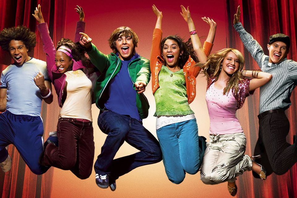 The cast of High School Musical leaping in the air.