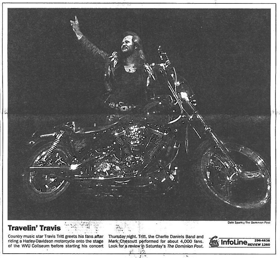 Travis Tritt rides onto the Coliseum stage on his Harley Davidson to open the 1995 concert. Photo courtesy of The Dominion Post