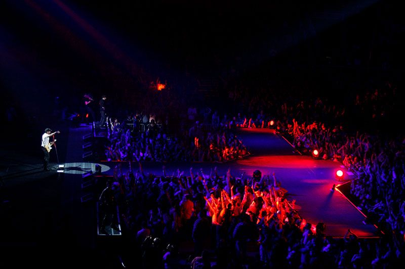 The Coliseum stage bathed in red and purple lights