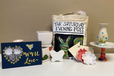 Various DIY crafts including a WVU photo frame, a custom-painted tote bag, painted vases.