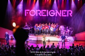 Foreigner and the Morgantown High School Choir performing at the WVU Creative Arts Center.