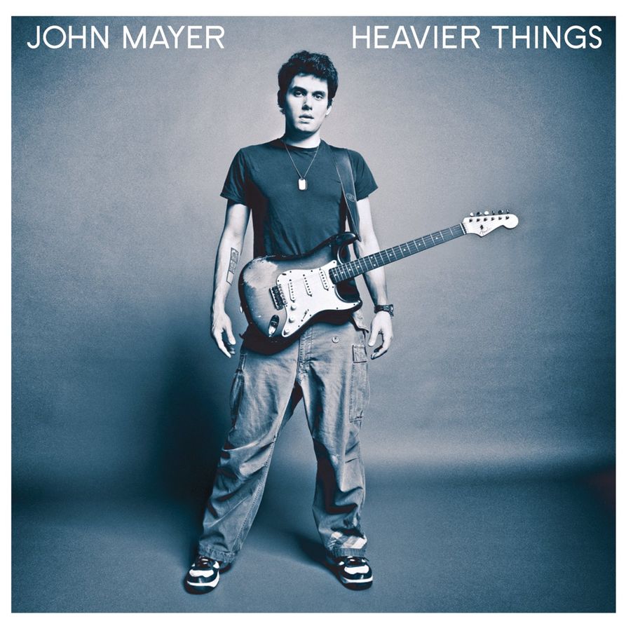 Album cover for Heavier Things with a photo of Mayer and his guitar in black and white.