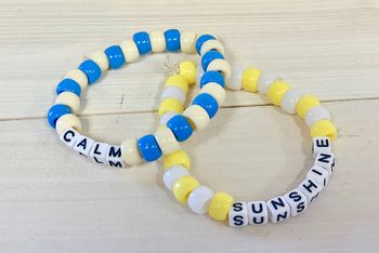 beaded bracelets with the words calm and sunshine