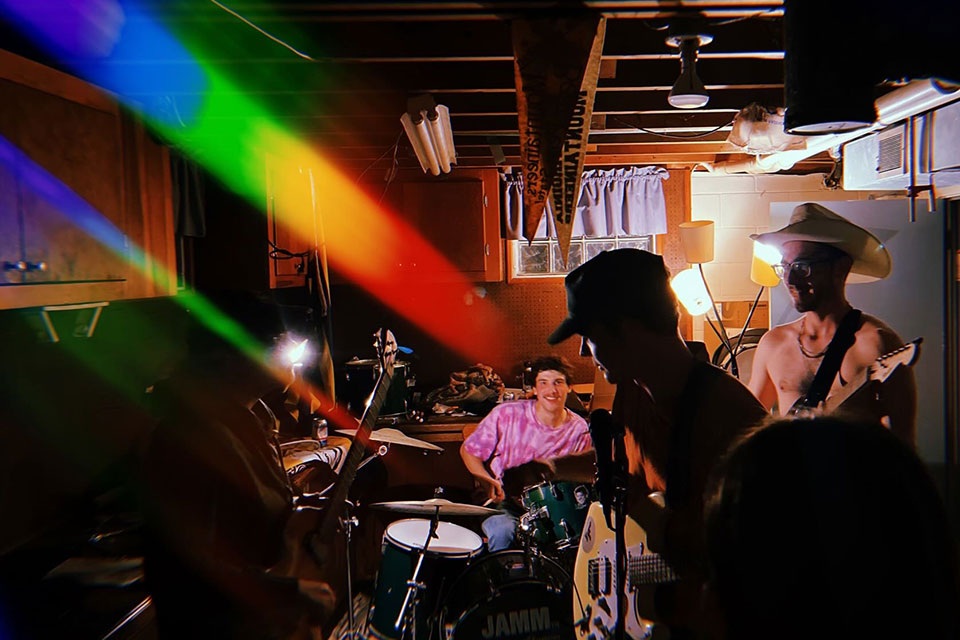 Members of the band Porch Couch perform at a house party.