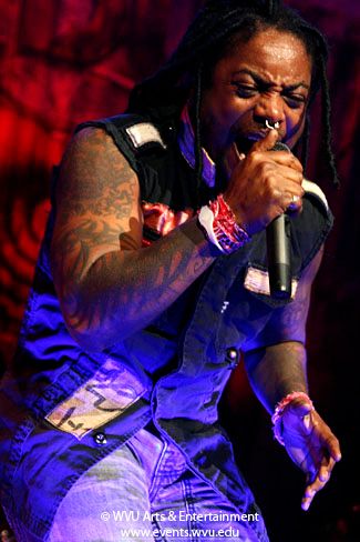 a member of the band Sevendust on stage at the Coliseum