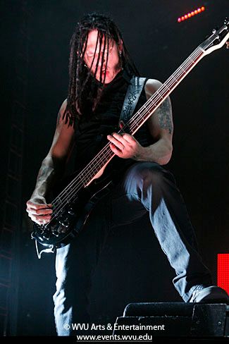 a member of the band Disturbed performing at the Coliseum in 2011