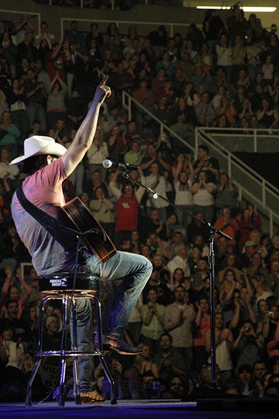 Brad Paisley raising the number one sign in front of a sell out crowd at the Coliseum in 2006.