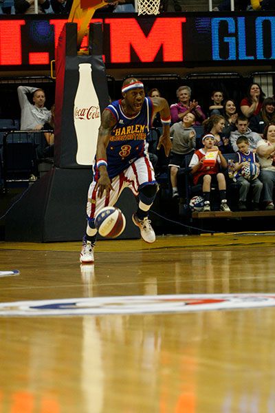 Globetrotter dribbling the basketball down the floor