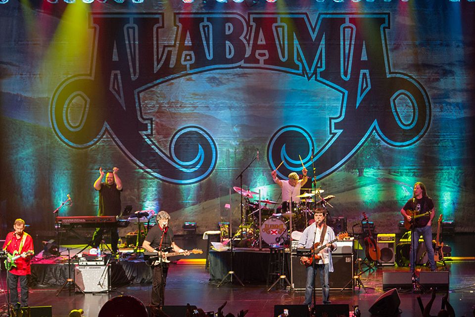 Colorful photo of Alabama performing on stage.