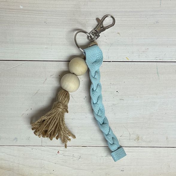 Pastel blue leather keychain adorned with wooden beads