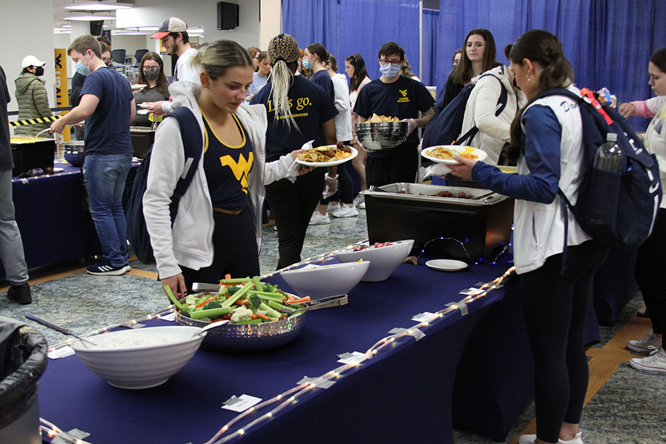 Student make their way through the buffet line