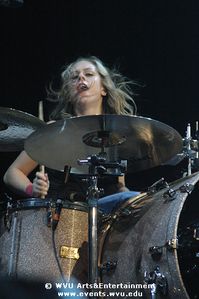 Torry Castellano of The Donnas plays drums at the Coliseum.